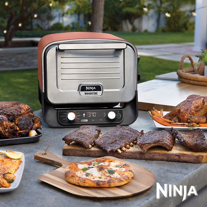 The Ninja Woodfire Electric Outdoor Oven is a pizza oven, BBQ and